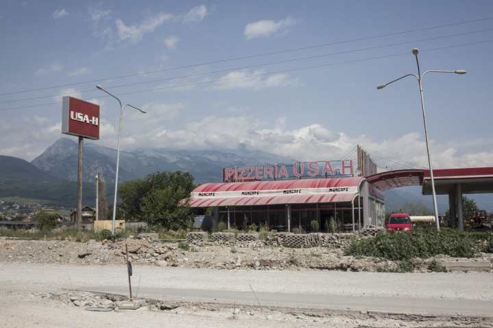 Pizzeria and gas station USA-H, located on the route between Prishtina and Peja, West Kosovo. The name refers to the initials of the three brothers who run it, although the order of the acronyms is intentional.