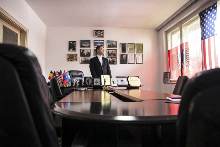 Agim Rexhepi, president of the Association of Friends of America in Kosovo, poses for a portrait in his office in Prishtina, where he has hung on the wall some of Bill Clinton’s letters thanking him for his work to defend the image of the United States in