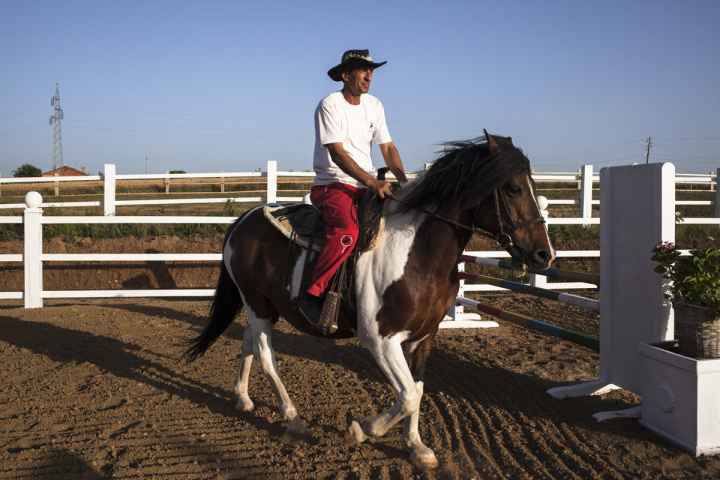 One of the Vali Ranch workers returns a horse to the stables after a jump show. It is a leisure complex that seeks to recreate elements of the American West and American culture in general, located in Perlepnicë, near the city of Gjilan, south of Kosovo.