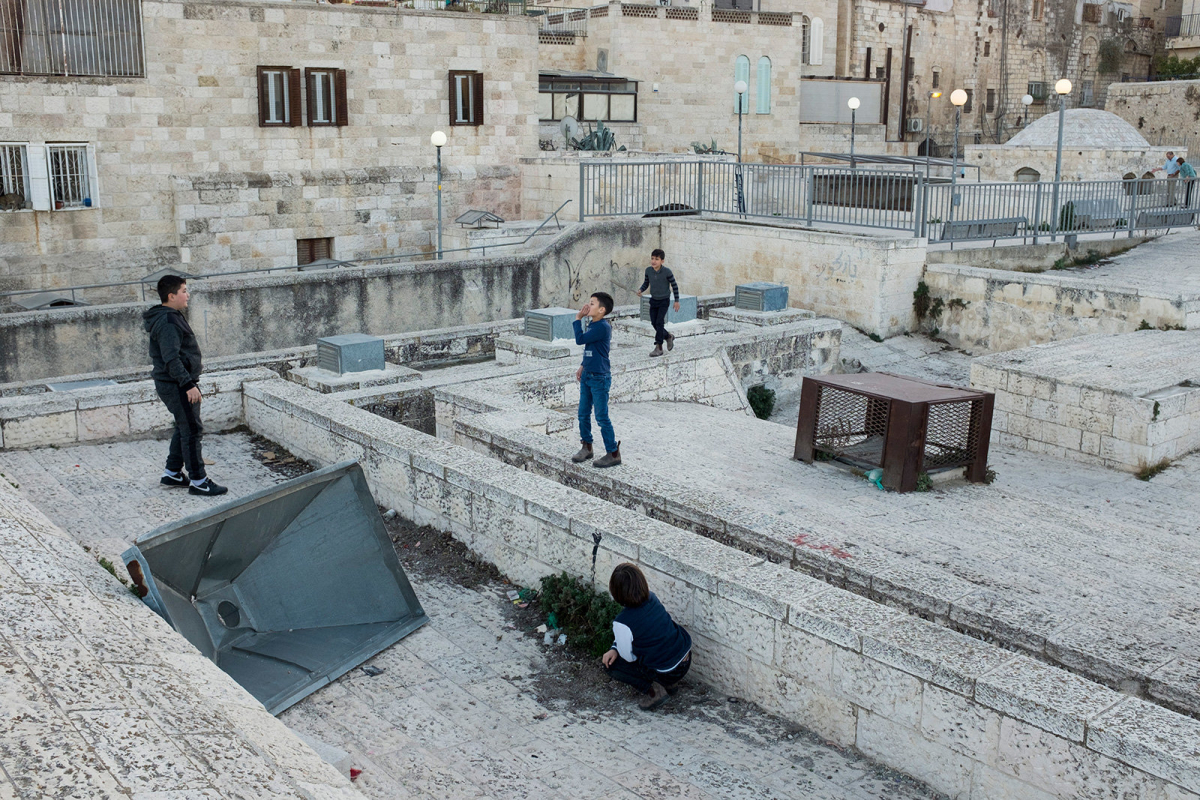 Palestinian boys play on the roof tops. 