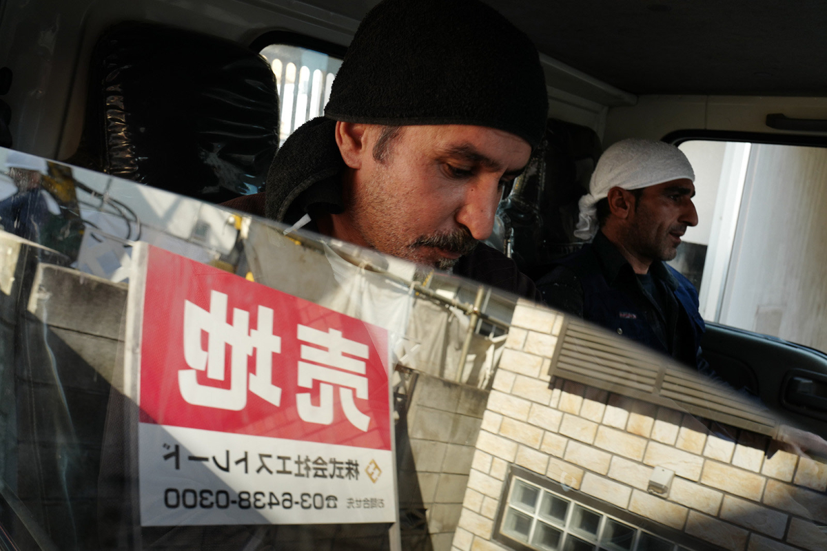 Mehmet inside a truck during work. He moved in Japan six years ago, his visa expires every 6 months. He works for many construction companies, so that he can be called almost every day.