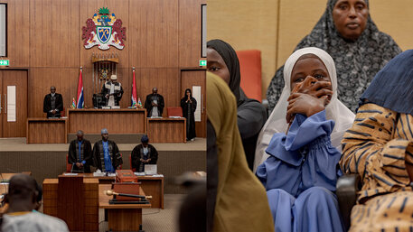 Parlamentarier in der Nationalversammlung-Junges Mädchen beobachtet die Debatte